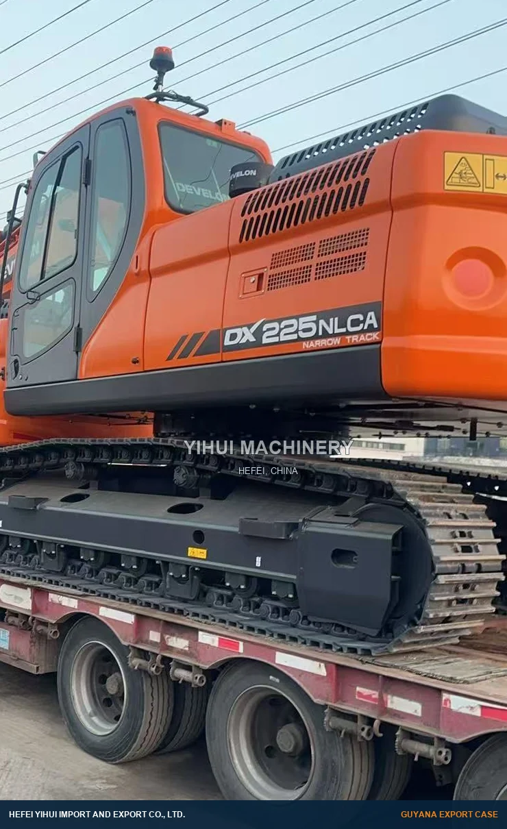 DEVELON DX225NLCA on a road trailer before the port stage