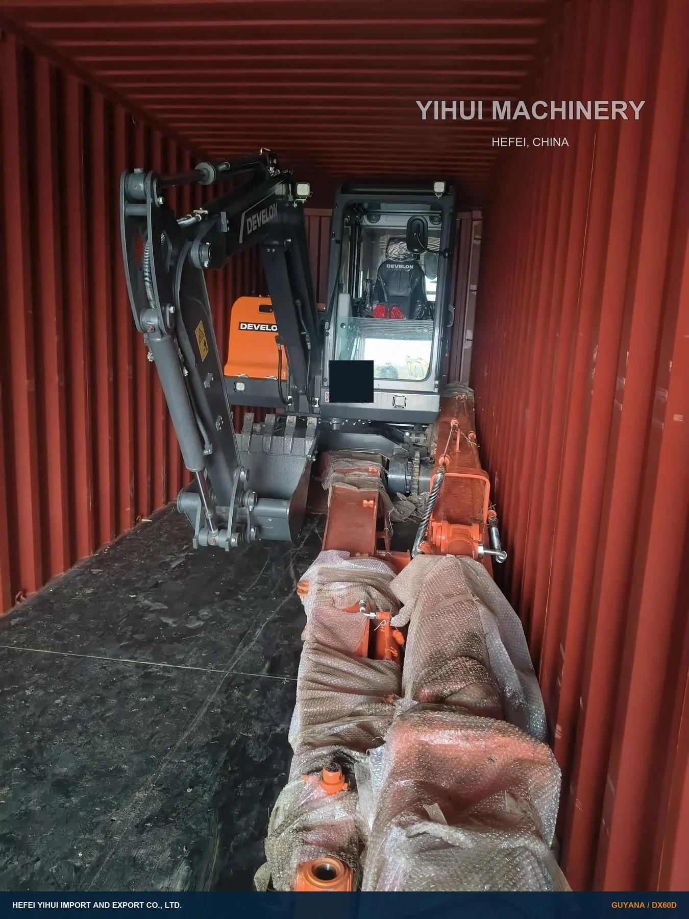 DEVELON DX60D machine body and protected components in the export container