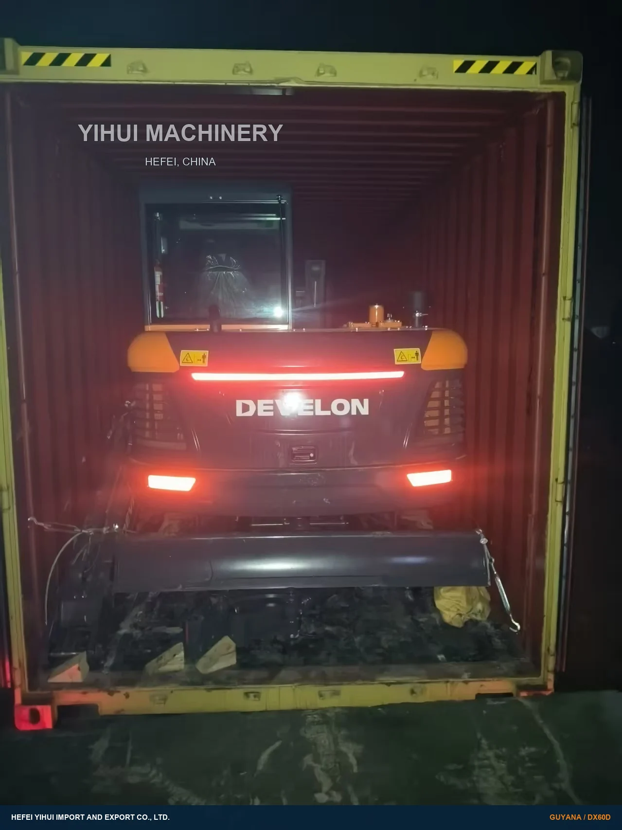 DEVELON excavator positioned inside a high-cube container