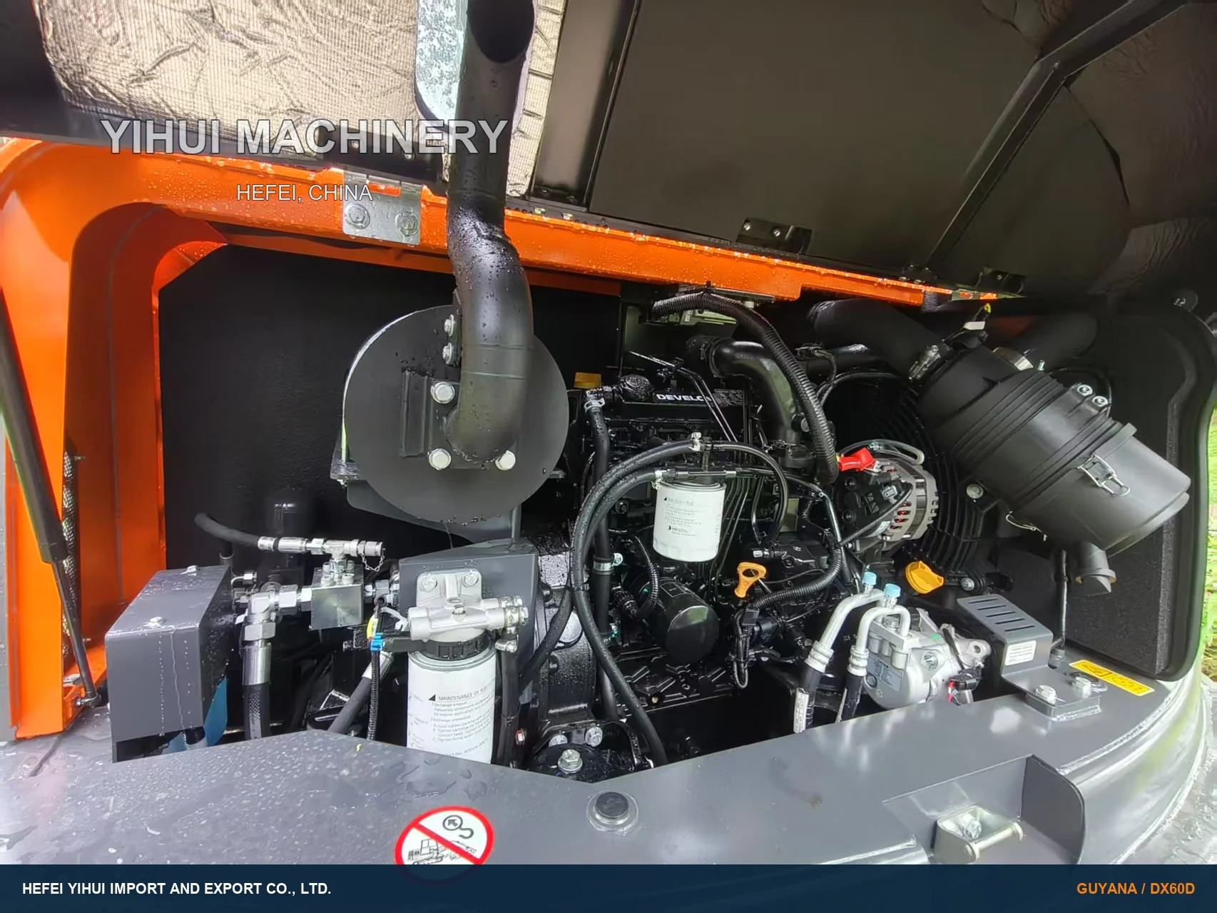 Open engine and service compartment of a DEVELON DX60D