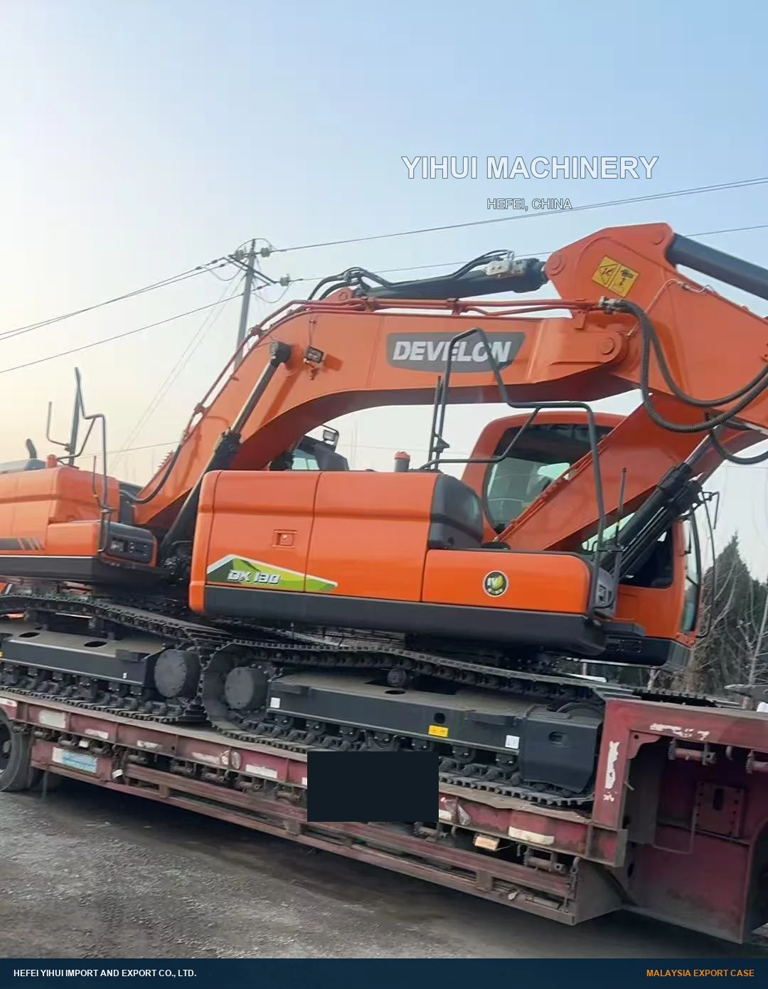 DEVELON DX180 crawler excavator on a road trailer