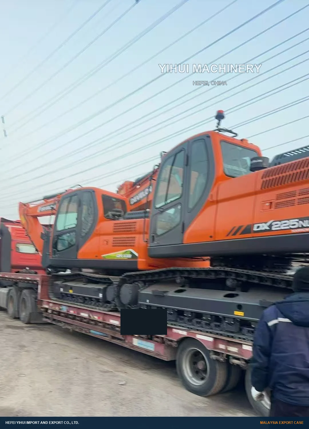 DEVELON excavators lined on road trailers for export transport