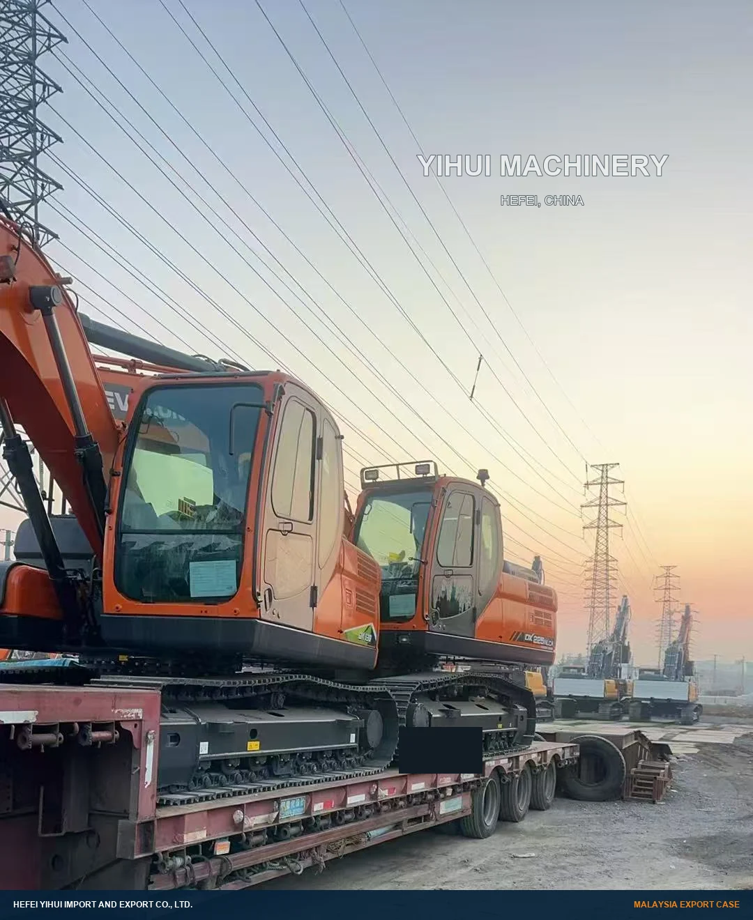 Two DEVELON crawler excavators on a road trailer before export to Malaysia