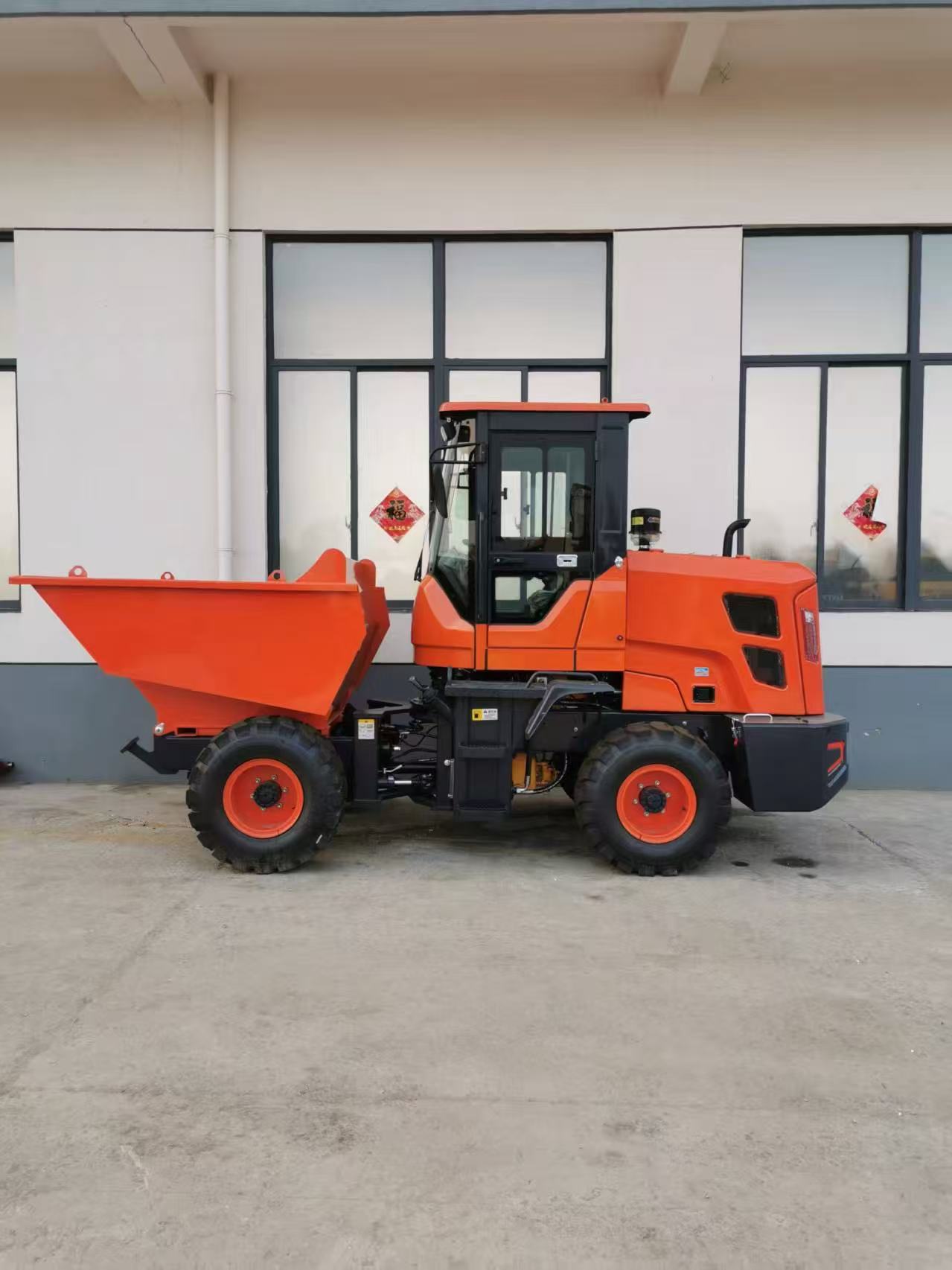 Orange site dumper with a front tipping skip photographed before export from China