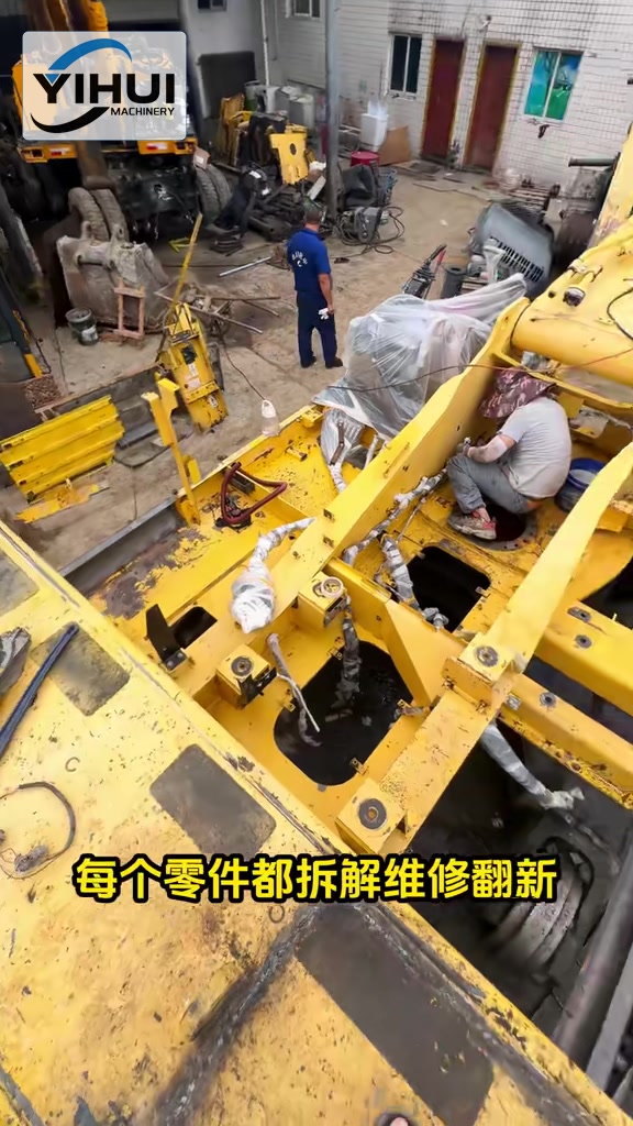 YIHUI technicians working inside a dismantled excavator upper structure