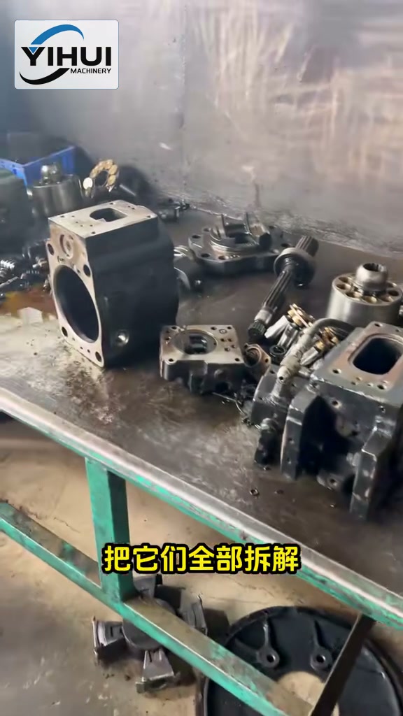 Disassembled hydraulic pump components on a YIHUI workshop bench